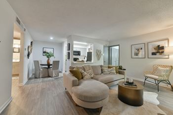 A living room with a couch and a table